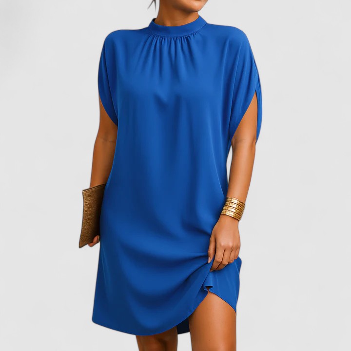Loose Fit Shift Mini Dress with Cap Sleeves and High Mock Neckline — model wearing