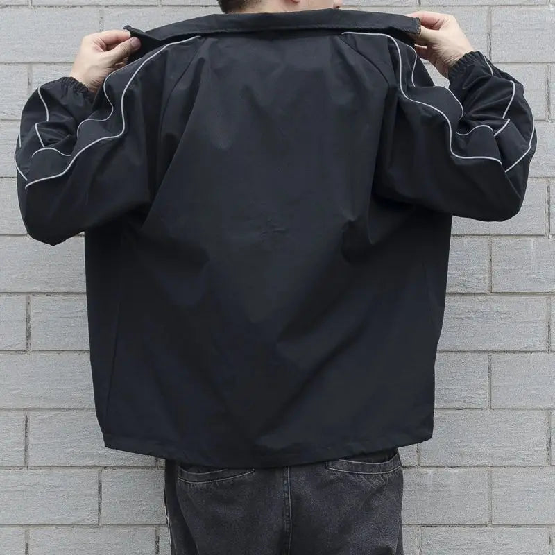 Men's Waterproof Jacket – Stylish Patchwork Design for Outdoor Adventures — model wearing