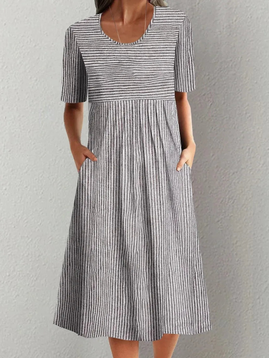 Summer Stripe Midi Dress – Casual O-Neck Design with Pockets for Effortless Warm Weather Style — model wearing