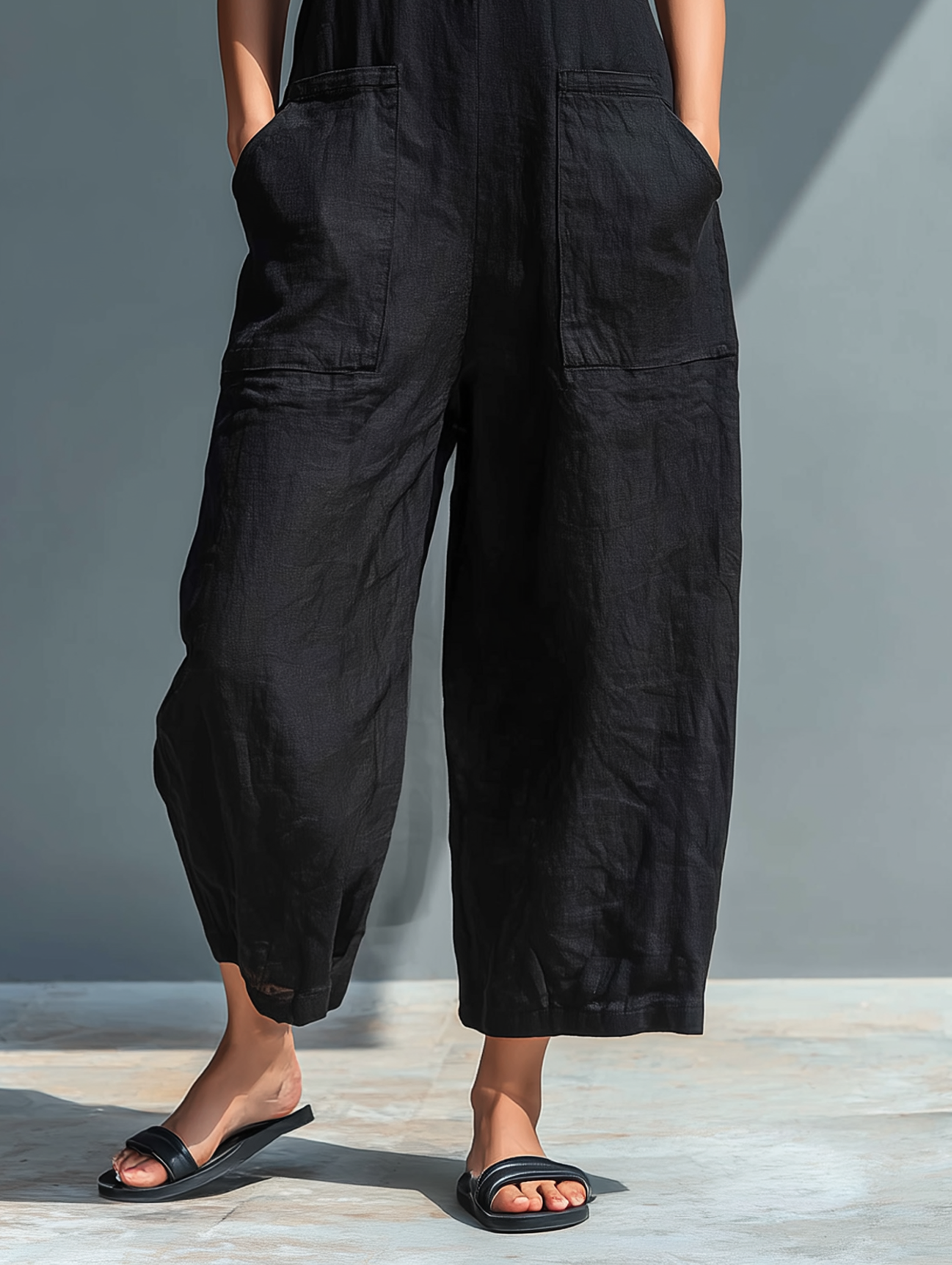 Women's Sleeveless Mandarin Collar Wide Leg Jumpsuit with Button Front — model wearing